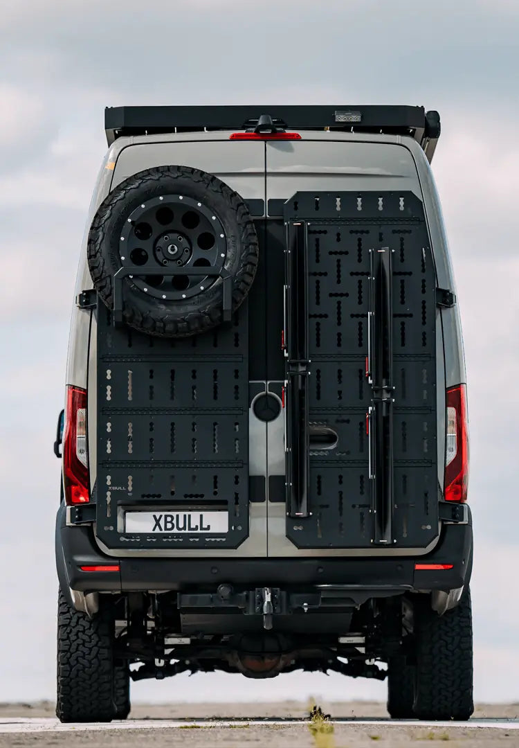 Detailed view of an XBull rear door carrier system on a Sprinter